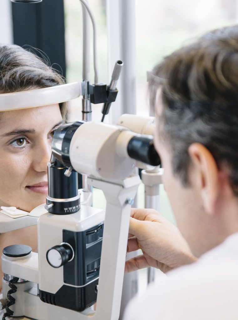 Eye Doctor examinating a young patient